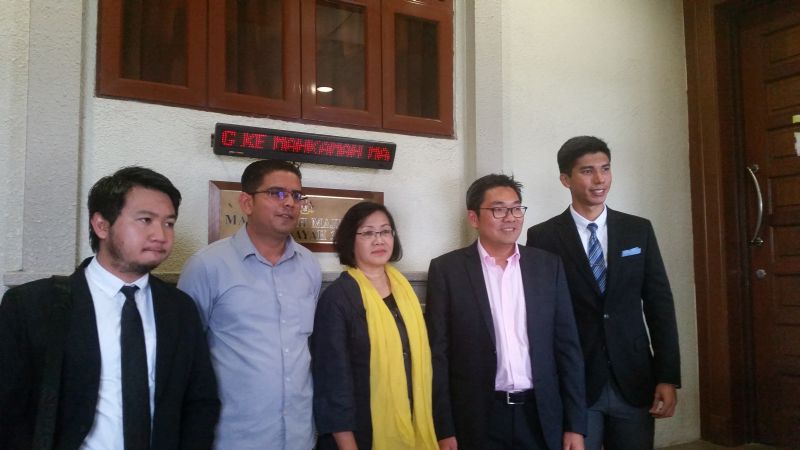 Bersih 2.0's Mandeep Singh (second from left), Maria Chin Abdullah (centre) and PKR MP Sim Tze Tzin (second from right) with their lawyers after being slapped again with a previously dropped charge of joining a 2015 u00e2u20acu02dcstreet protestu00e2u20acu2122. u00e2u20acu201d Picture by Id