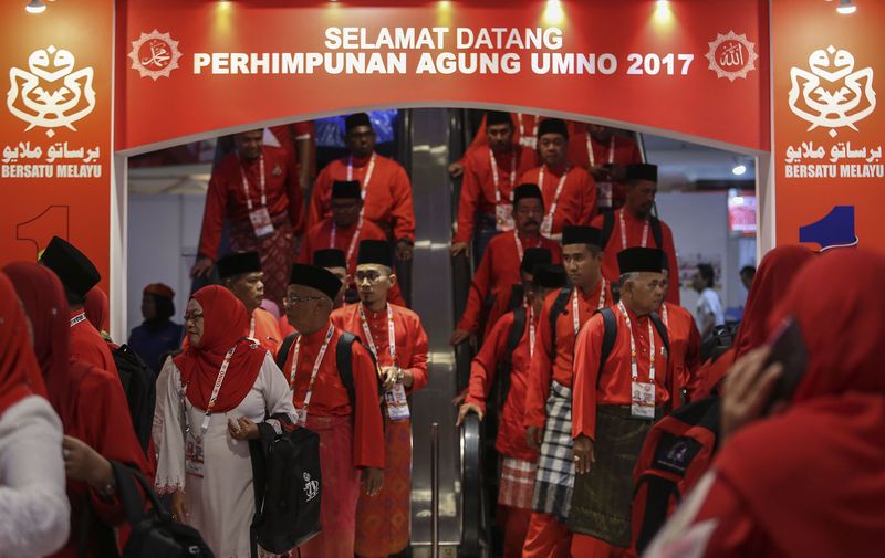 Delegates leaving the Merdeka Hall after the third day of the 71st Umno General Assembly at Putra World Trade Center in Kuala Lumpur, December 7, 2017. u00e2u20acu201d Picture by Yusof Mat Isa