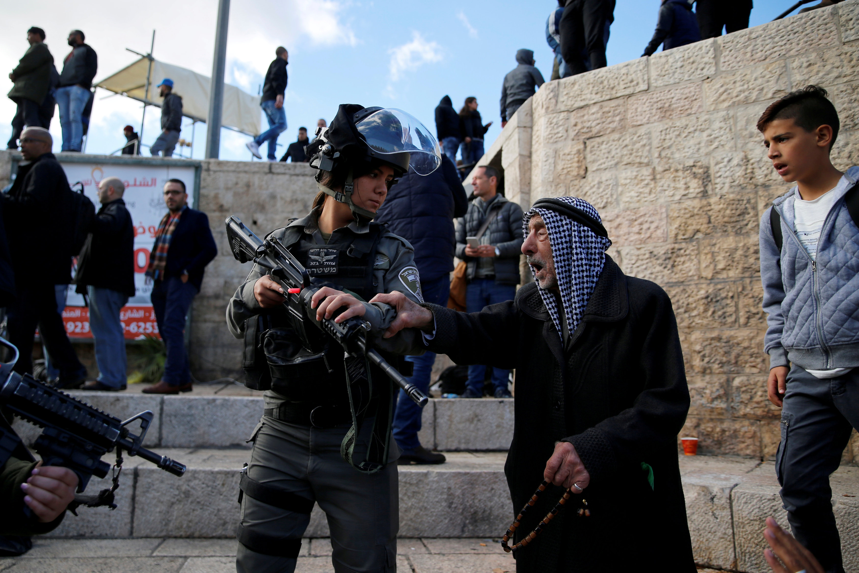 A Palestinian man argues with an Israeli border policewoman during a protest near Damascus Gate in Jerusalem's Old City December 7, 2017. u00e2u20acu201d Reuters pic