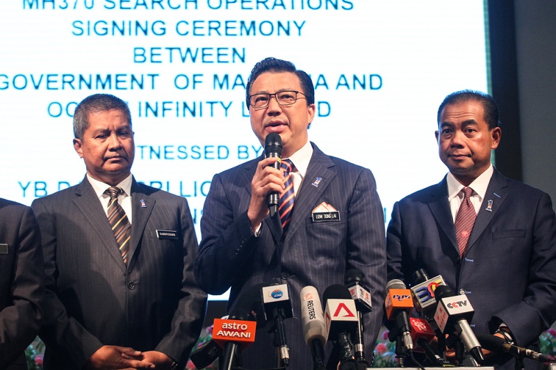 Transport Minister Datuk Seri Liow Tiong Lai (centre) speaks during a press conference in Kuala Lumpur January 10, 2018. u00e2u20acu201d Picture by Shafwan Zaidon