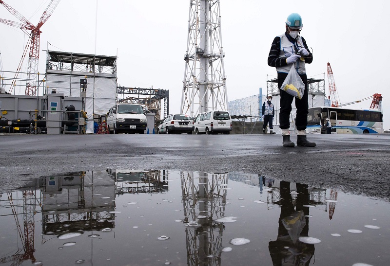 A member of the media uses a geiger counter at Tokyo Electric Power Cou00e2u20acu2122s (TEPCO) Fukushima Dai-ichi nuclear power plant in Okuma, Fukushima on February 23, 2017. u00e2u20acu201d AFP pic