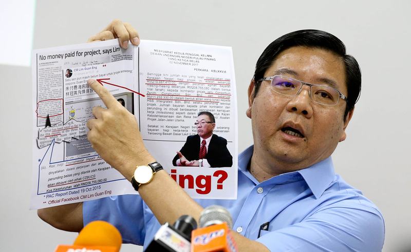 Penang BN Chairman Teng Chang Yeow showing Lim Guan Eng's facebook page regarding the Undersea Tunnel and 3 highway at Penang Gerakan Headquarters January 16, 2018. u00e2u20acu201d Picture by Sayuti Zainudin