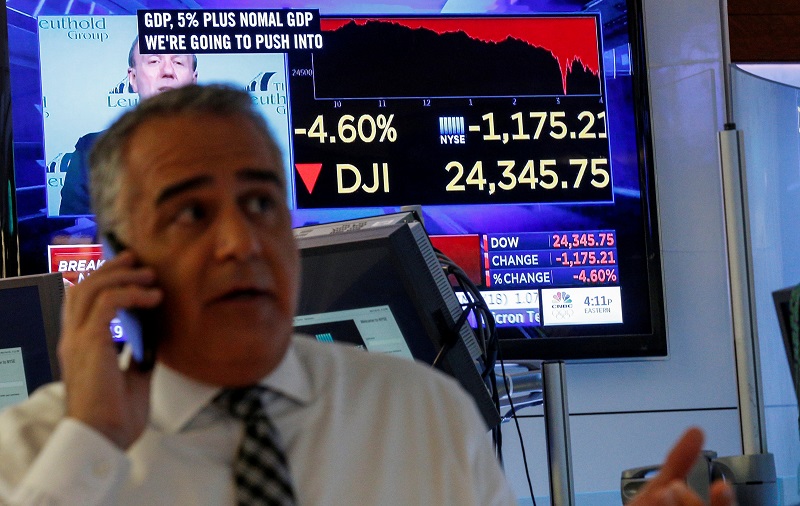 A trader works on the floor following the closing bell as a screen shows the Dow Jones Industrial Average on the New York Stock Exchange, (NYSE) in New York February 5, 2018. u00e2u20acu201d Reuters pic