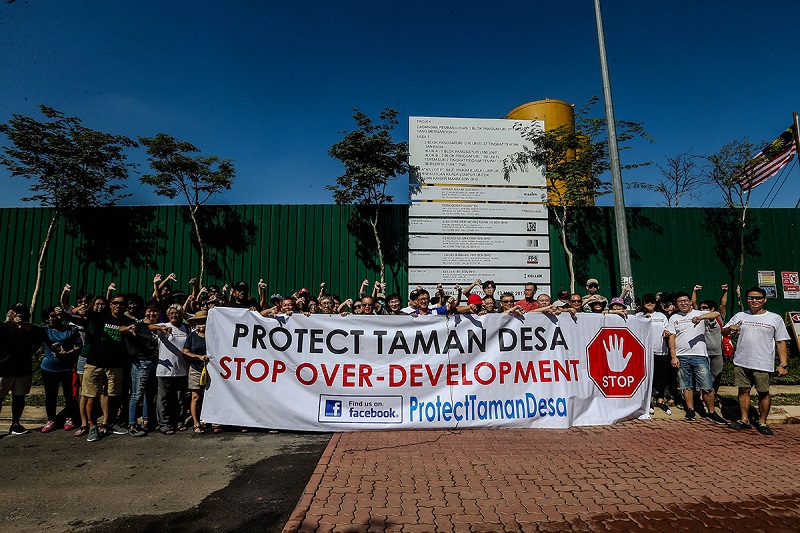 Residents hold up a large banner in protest against a high-rise condominium project at Taman Desa, Kuala Lumpur February 4, 2018. u00e2u20acu201d Picture by Hari Anggara
