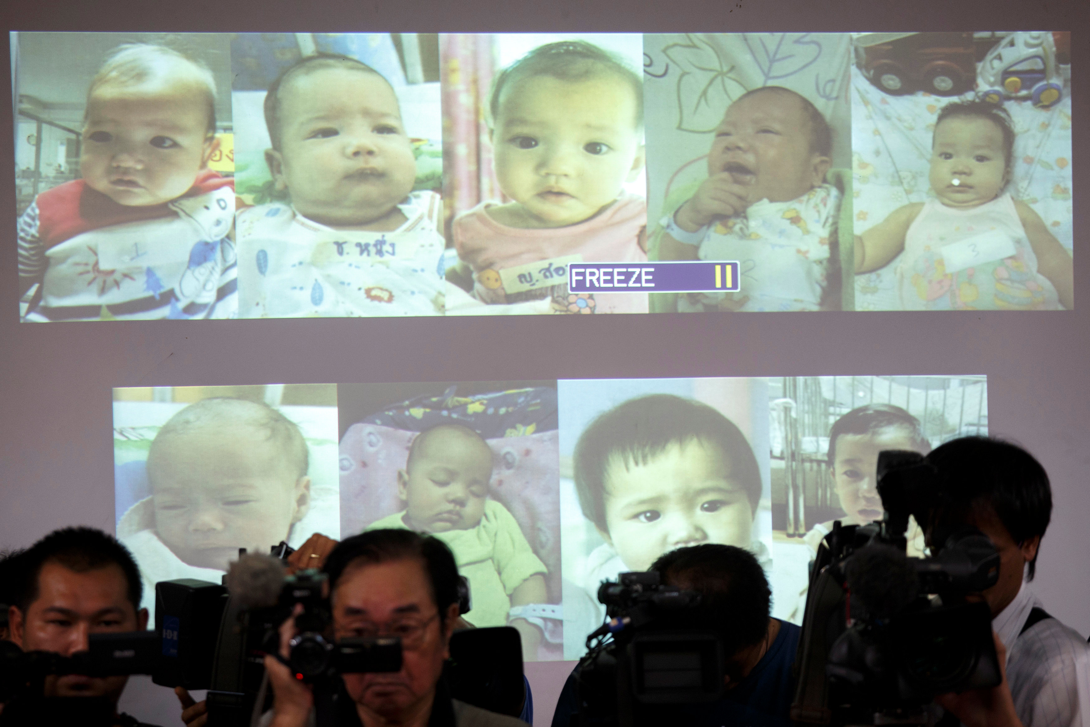 Surrogate babies that Thai police suspect were fathered by a Japanese businessman who has fled from Thailand are shown on a screen during a news conference at the headquarters of the Royal Thai Police in Bangkok August 12, 2014. u00e2u20acu201d Reuters pic