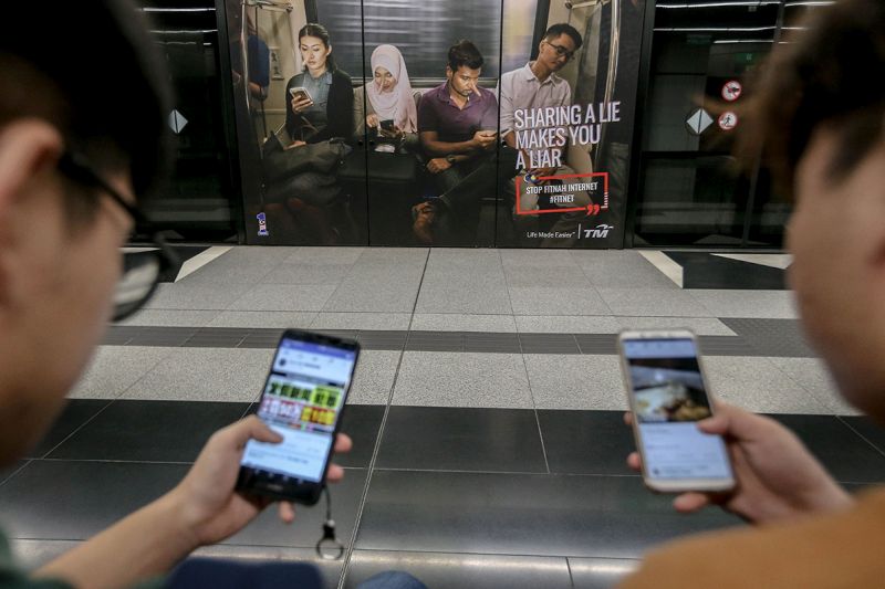An advertisement discouraging the dissemination of fake news is pictured at a train station in downtown Kuala Lumpur March 26, 2018. u00e2u20acu201d Picture by Hari Anggara