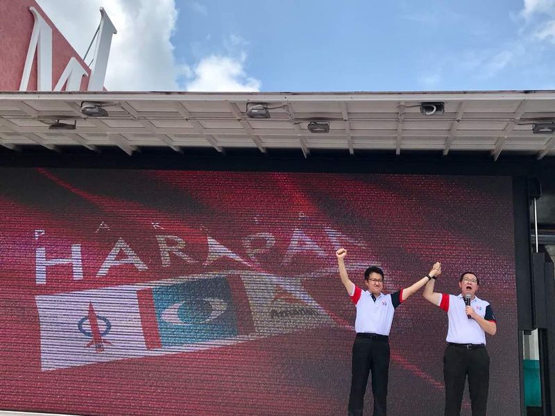 Johor DAP chief Liew Chin Tong (left) has been announced as Pakatan Harapanu00e2u20acu2122s (PH) Ayer Hitam parliament candidate during DAPu00e2u20acu2122s 52nd anniversary event held at the Ayer Hitam PH election centre in Bandar Baru in Ayer Hitam, March 18, 2018. u00e2u20acu201d Picture 