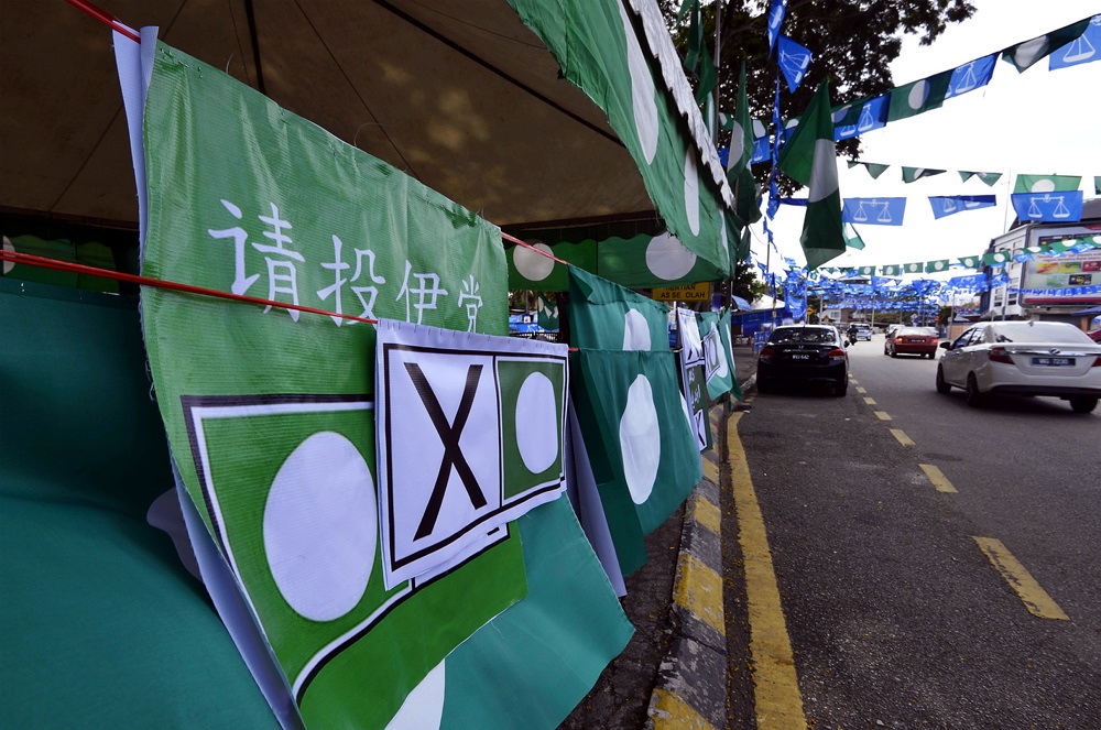 The flags of various political parties line Jalan Datuk Keramat in Kuala Lumpur April 16, 2018. u00e2u20acu201d Picture by Ham Abu Bakar