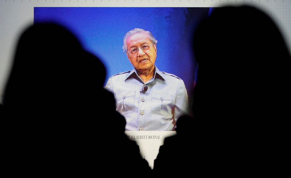 Prime Minister Tun Dr Mahathir Mohamad is seen on video conference screen during the Wall Street Journal CEO Conference in Tokyo May 15, 2018. u00e2u20acu201d Reuters pic
