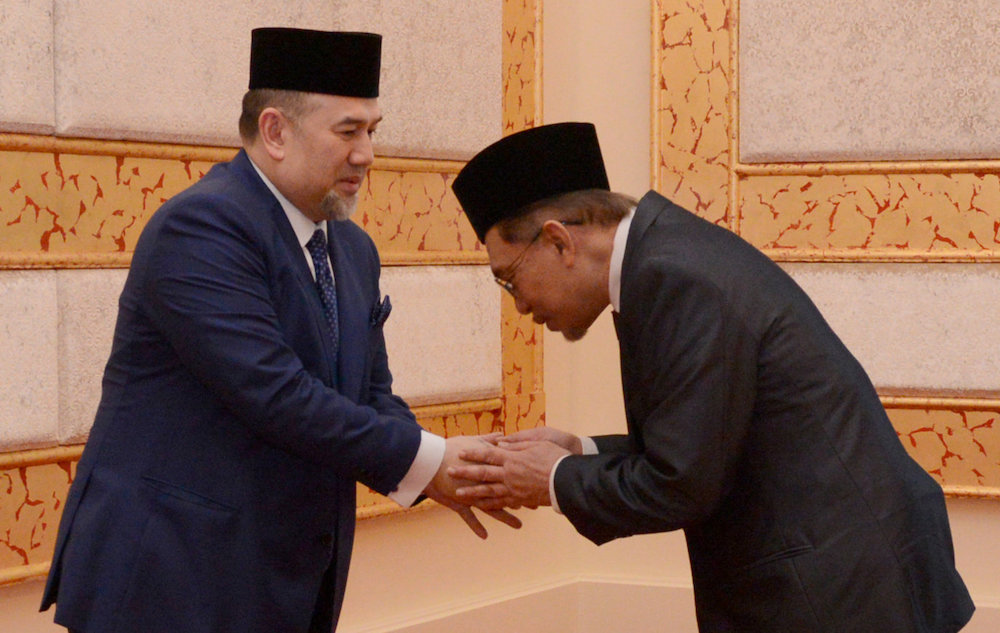 Datuk Seri Anwar Ibrahim greets Yang Di-Pertuan Agong Sultan Muhammad V at Istana Negara in Kuala Lumpur May 16, 2018. u00e2u20acu201d Reuters pic