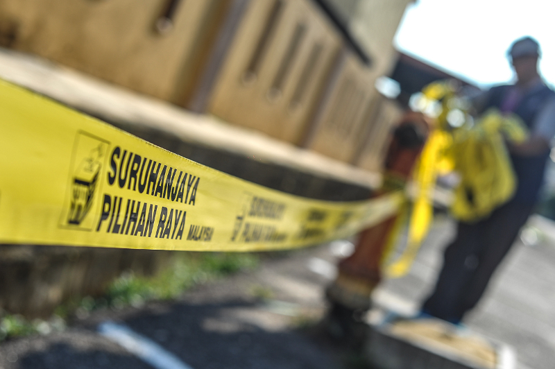 The Election Commission (EC) logo is seen on yellow tape around the SK Yong Peng voting centre in Yong Peng May 9, 2018. u00e2u20acu201d Picture by Shafwan Zaidon