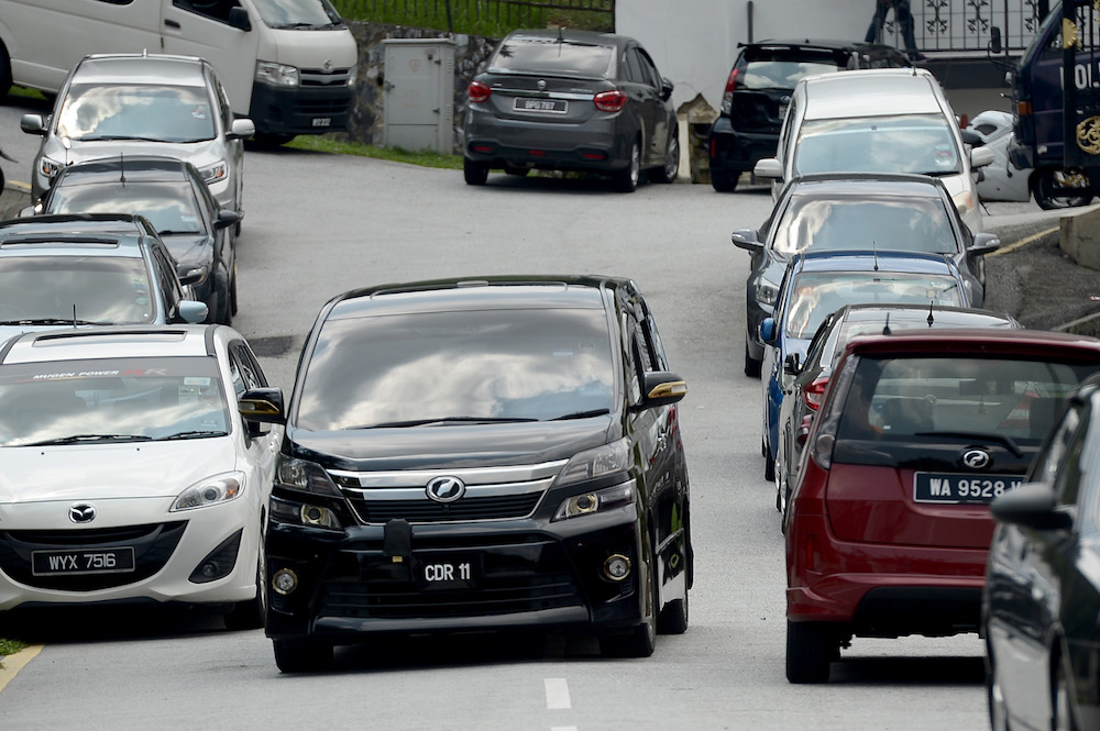 A vehicle believed to be ferrying one of Najibu00e2u20acu2122s sons is seen leaving the former prime ministeru00e2u20acu2122s house in Kuala Lumpur May 17, 2018. u00e2u20acu2022 Picture by Mukhriz Hazim