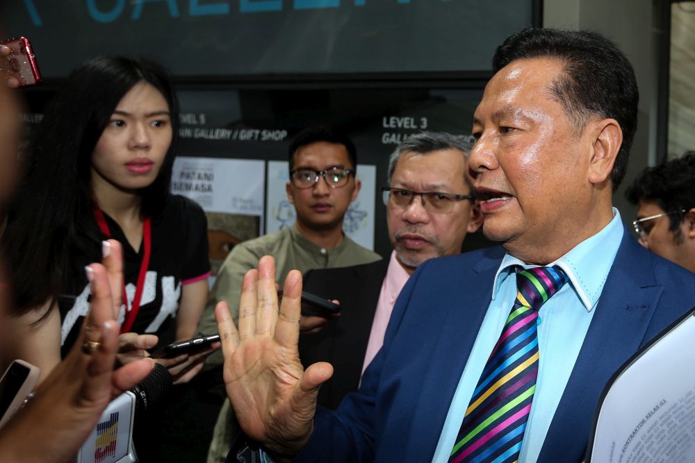 Malaysian Malay Contractors Association president Datuk Mokhtar Samad speaks to reporters at the entrance of the Ilham Tower on May 24, 2018. u00e2u20acu201d Picture by Ahmad Zamzahuri