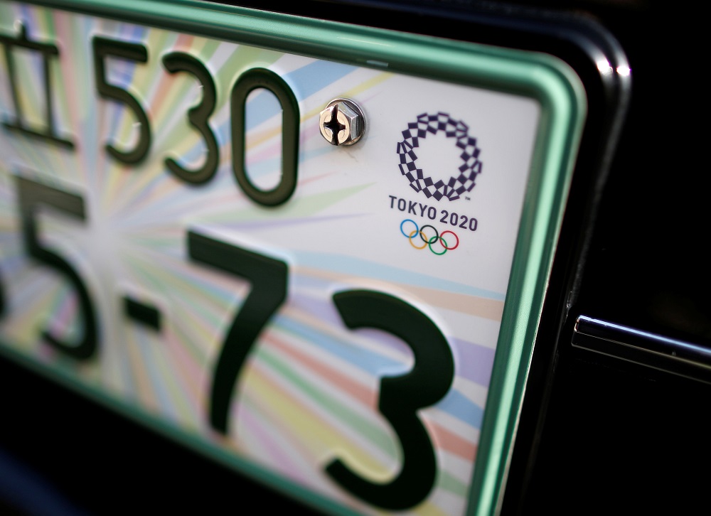 The registration plate featuring the 2020 Tokyo Olympics logo is seen on the front part of Toyota Motor Cou00e2u20acu2122s u00e2u20acu02dcJPN Taxiu00e2u20acu2122 vehicle at the service branch of Hinomaru Kotsu Co in Tokyo May 14, 2018. u00e2u20acu201d Reuters pic