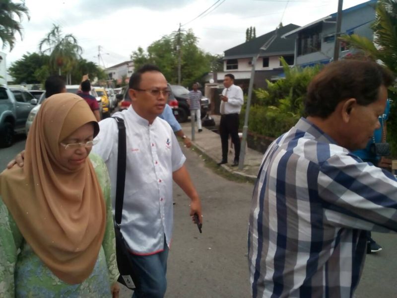Datuk Abdul Muis Picho and Datuk Hamisah Samat are seen leaving Datuk Seri Shafie Apdalu00e2u20acu2122s residence in Kota Kinabalu May 11, 2018. u00e2u20acu2022 Picture by Julia Chan