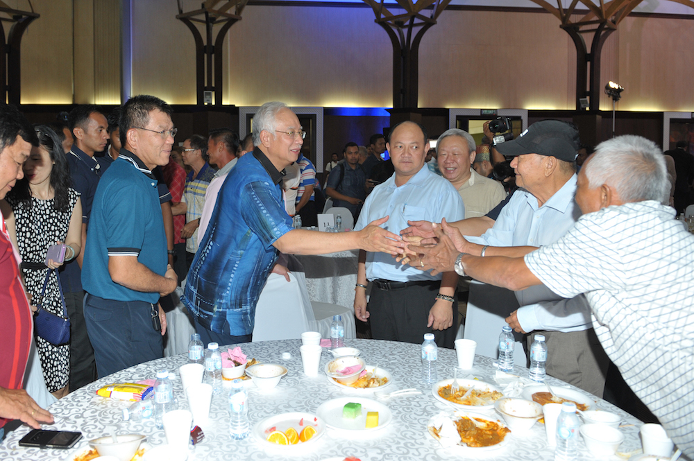 Datuk Seri Najib Razak shakes hands with guests at the Langkawi tourism industry gathering May 4, 2018. u00e2u20acu201d Picture by KE Ooi