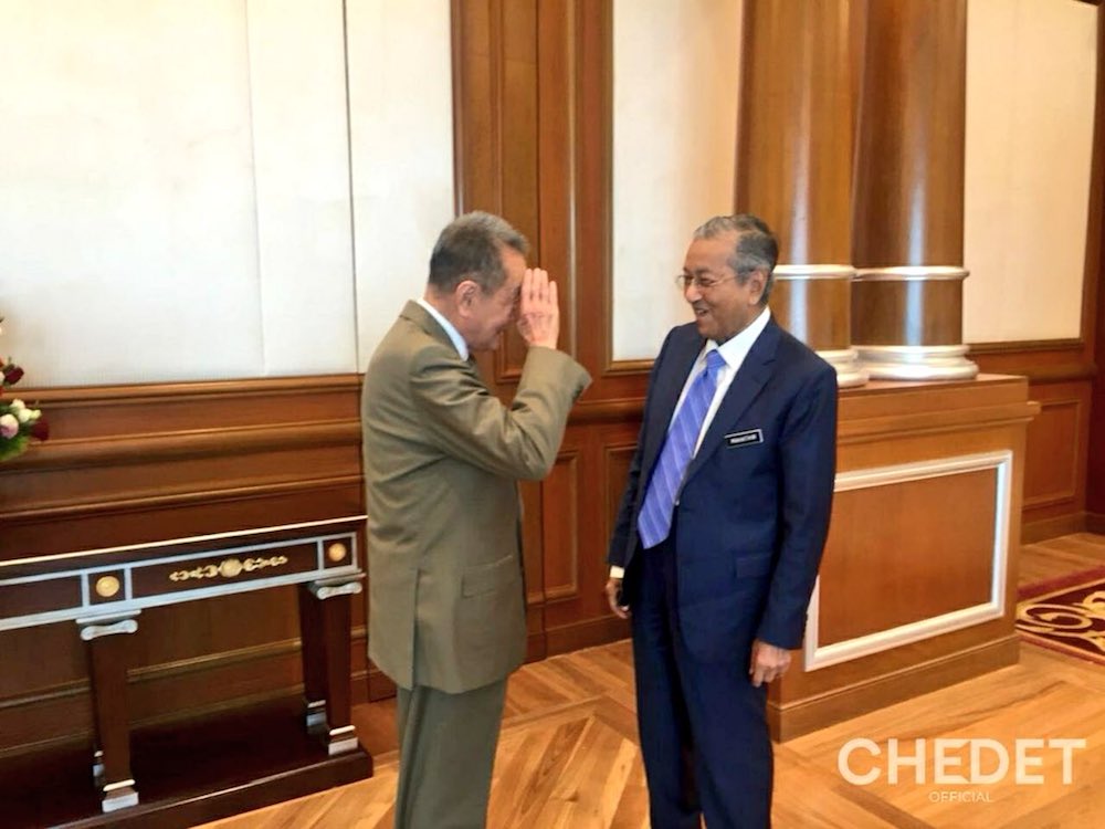 The tycoon salutes the PM at his office in Perdana Putra. u00e2u20acu201d Picture via Twitter/ChedetOfficial