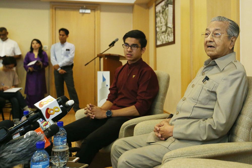 Syed Saddiq and Tun Dr Mahathir Mohamad address members of the press at the Perdana Leadership Foundation in Putrajaya on May 4, 2018. u00e2u20acu201d Picture by Azinuddin Ghazali