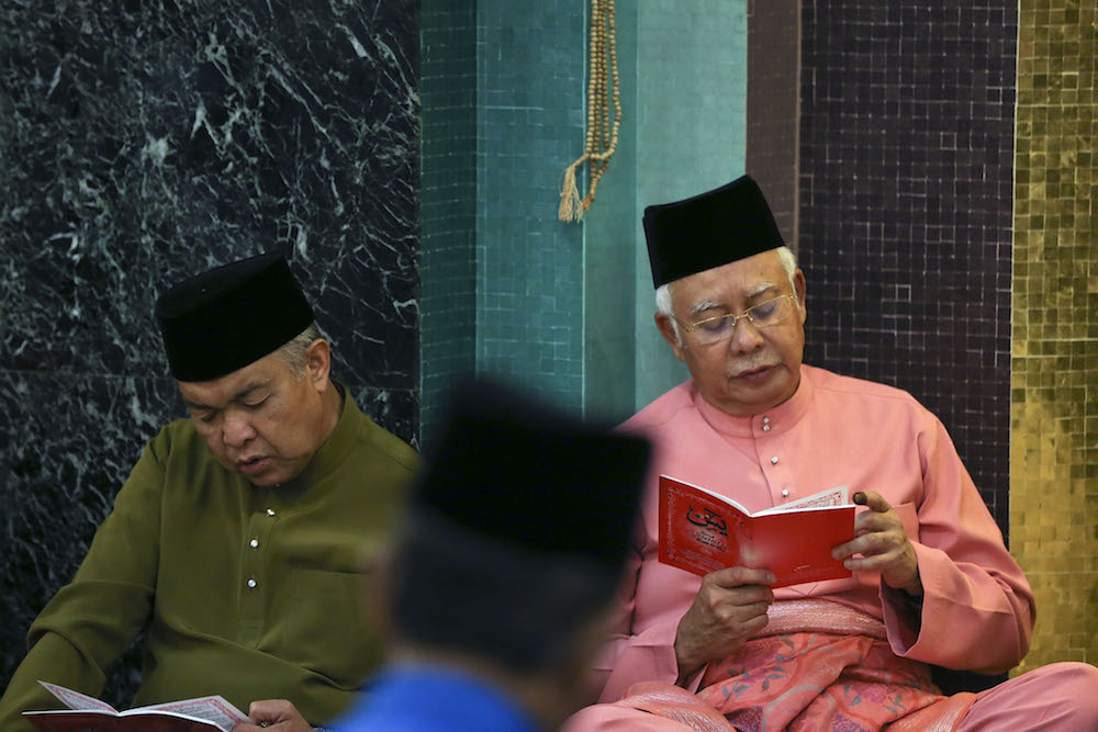 Datuk Seri Ahmad Zahid Hamidi and Datuk Seri Najib Razak attend special prayers for Umnou00e2u20acu2122s 72nd anniversary in Kuala Lumpur May 11, 2018. u00e2u20acu201d Picture by Azneal Ishak