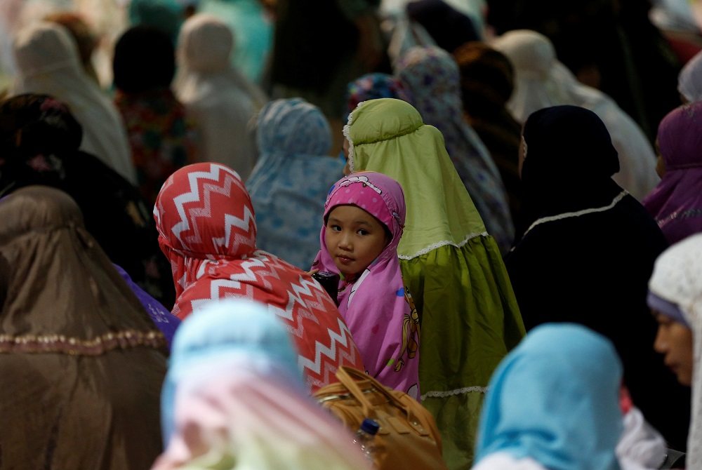 A Muslim girl attends prayers at the first day of the holy fasting month of Ramadan at Istiqlal mosque in Jakarta May 16, 2018. u00e2u20acu201d Reuters pic