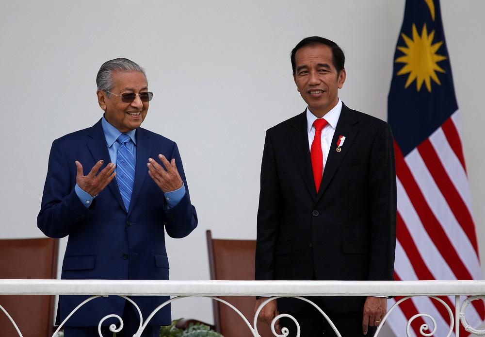 Prime Minister Tun Dr Mahathir Mohamad and Indonesian President Joko Widodo chat while on the balcony at the presidential palace in Bogor, south of Jakarta June 29, 2018. u00e2u20acu201d Reuters pic