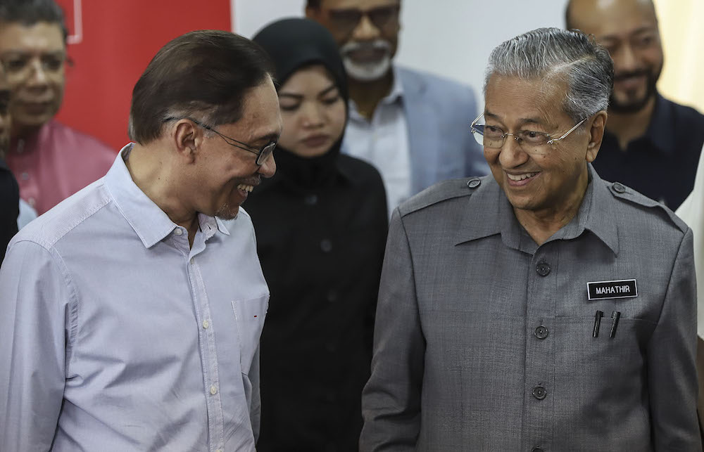 Tun Dr Mahathir Mohamad speaks to Datuk Seri Anwar Ibrahim during a press conference at Menara Yayasan Selangor on June 1, 2018. u00e2u20acu201d Picture by Azneal Ishak