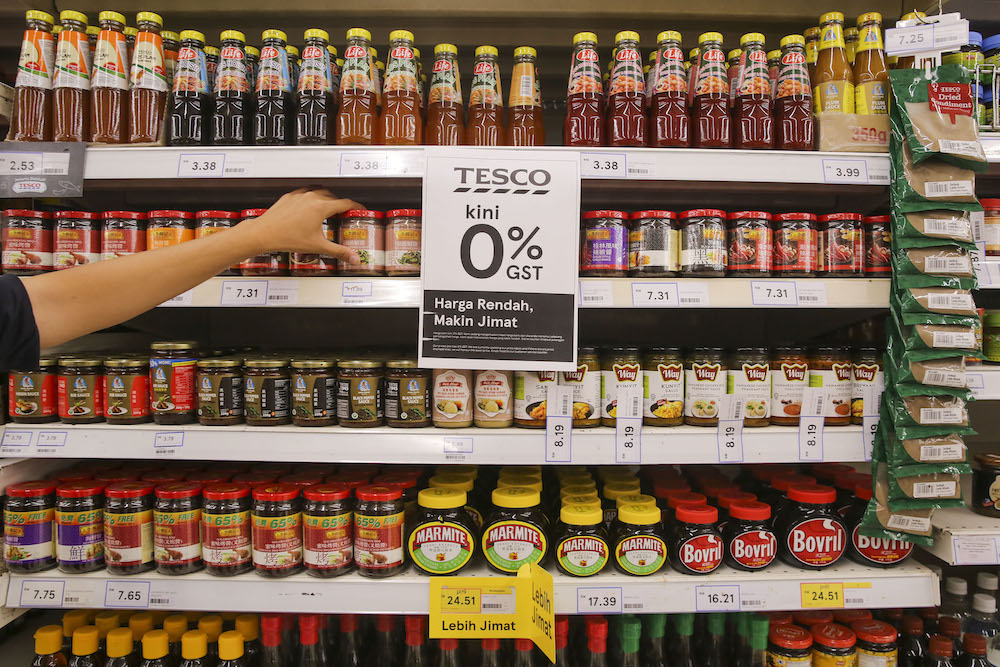 A sign announcing the zero-rated GST change is seen at a supermarket. u00e2u20acu201d Picture by Yusof Mat Isa