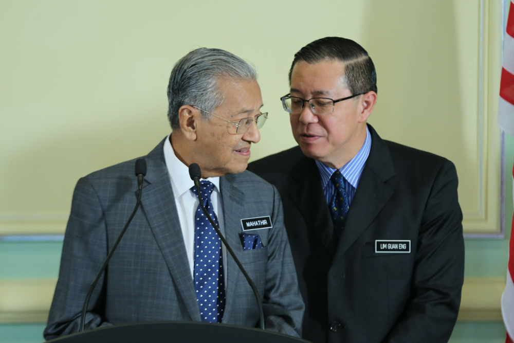 Tun Dr Mahathir Mohamad and Lim Guan Eng are seen after the post-cabinet meeting held at the Prime Ministeru00e2u20acu2122s Office June 6, 2018. u00e2u20acu201d Picture by Ahmad Zamzahuri