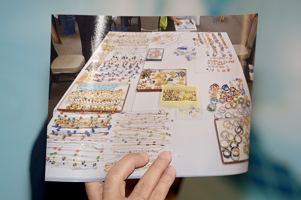 Datuk Seri Amar Singh displays a photo of some of the valuables seized in the raids conducted on Datuk Seri Najib Razaku00e2u20acu2122s properties, in Kuala Lumpur June 27, 2018. u00e2u20acu201d Picture by Mukhriz Hazim