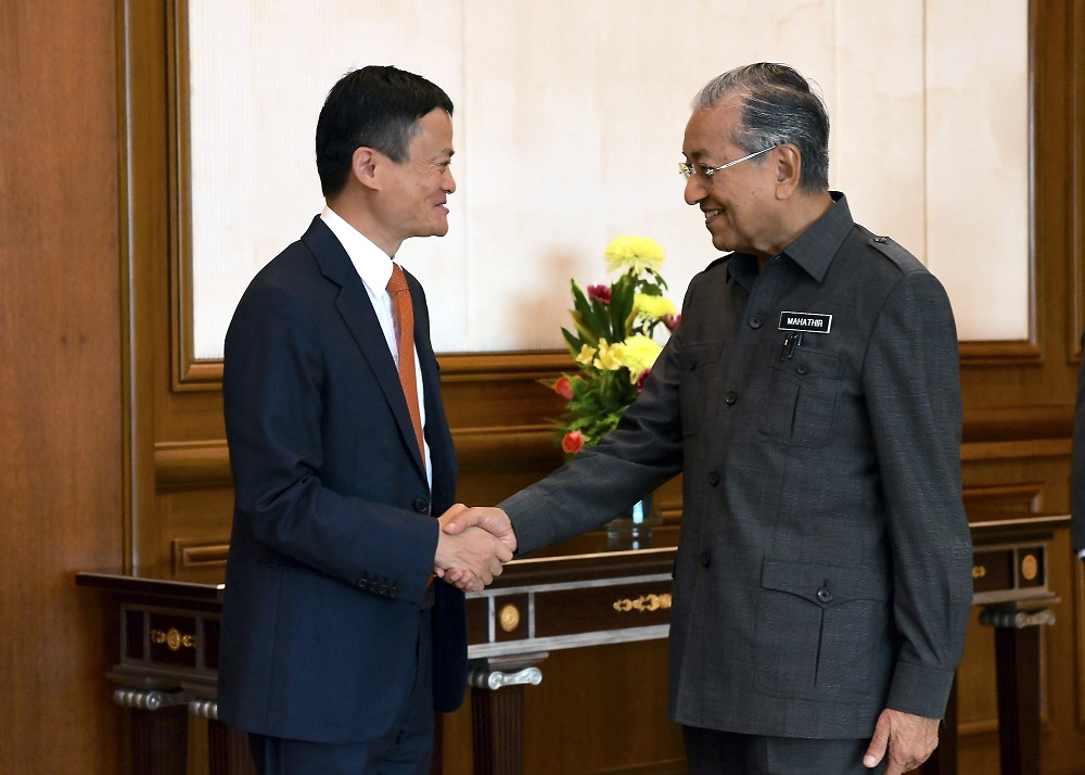 Prime Minister Dr Mahathir Mohamad shakes hands with Alibabau00e2u20acu2122s CEO Jack Ma ahead of a meeting at the Prime Ministeru00e2u20acu2122s Office in Putrajaya June 18, 2018. u00e2u20acu201d Bernama pic