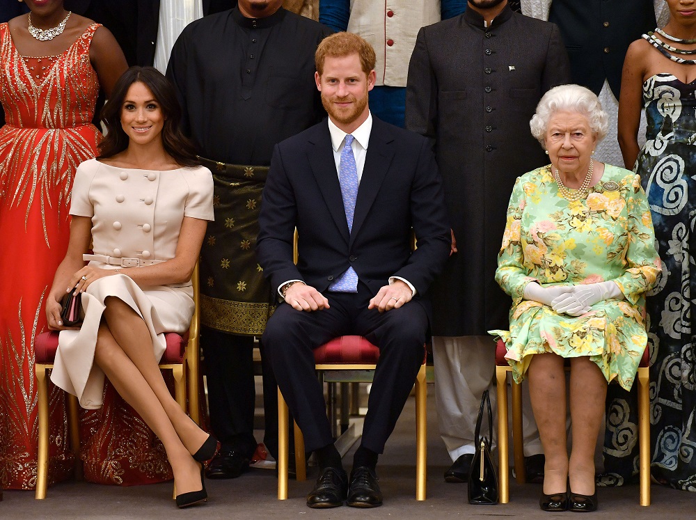 Britain's Queen Elizabeth II, Prince Harry and Meghan, the Duchess of Sussex at the final Queen's Young Leaders Awards Ceremony, London, June 26, 2018. u00e2u20acu201d Reuters pic
