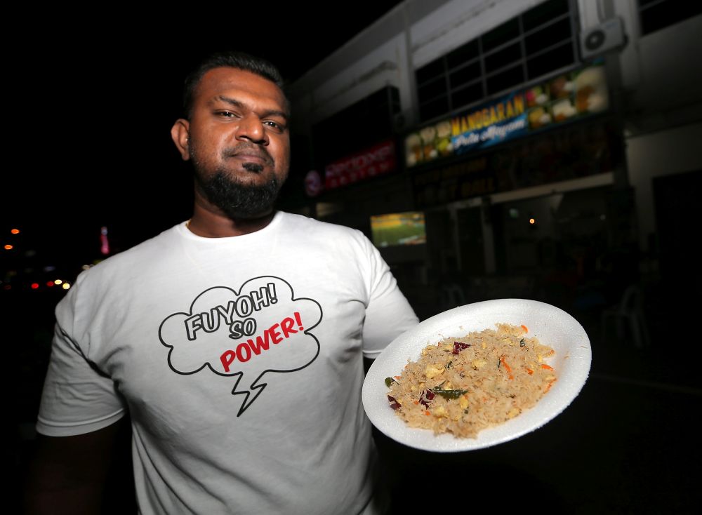 M. Thirumaran showing the special fired 'idiyapum' at his shop in Taman Desa Rishah in Ipoh. u00e2u20acu2022 Picture by Farhan Najib
