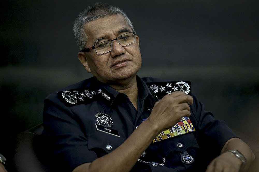 Inspector General of Police, Tan Sri Mohamad Fuzi Harun, speaks at a press conference in Bukit Aman July 11, 2018. u00e2u20acu201d Picture by Hari Anggara