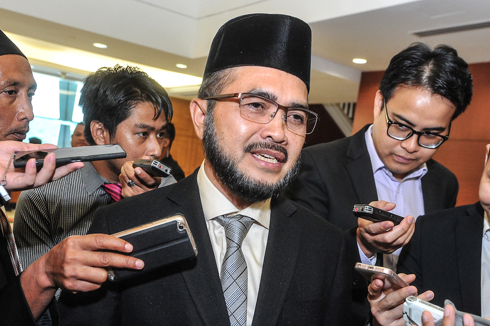 Pasir Puteh MP Datuk Nik Mohamad Zawawi Nik Salleh speaks to the media in the lobby of Parliament in Kuala Lumpur July 19, 2018. u00e2u20acu201d Picture by Shafwan Zaidon