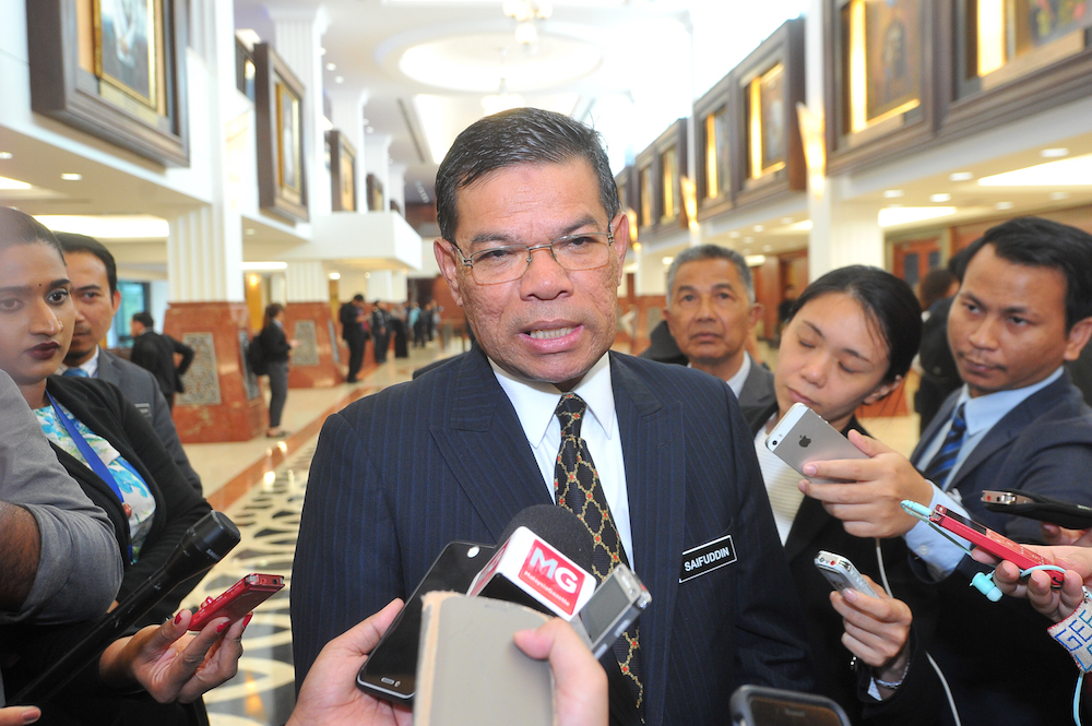 Domestic Trade, Co-operatives and Consumerism Minister Datuk Saifuddin Nasution Ismail speaks to the media in the lobby of Parliament in Kuala Lumpur July 19, 2018. u00e2u20acu201d Picture by Shafwan Zaidon