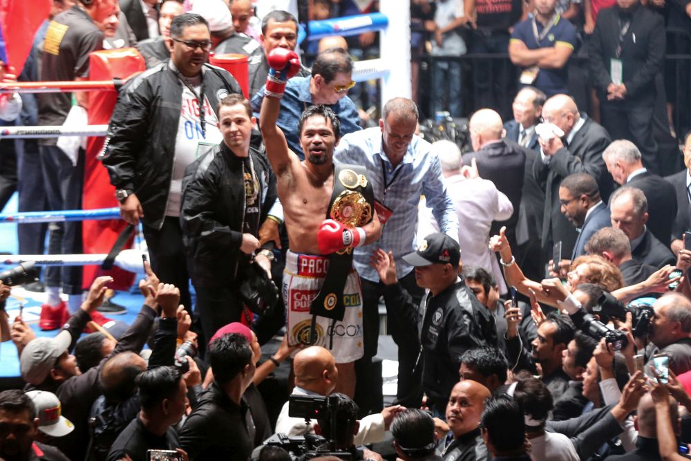 Manny Pacquiao poses with the WBA welterweight title after defeating Lucas Matthysse at the Axiata Arena, Kuala Lumpur July 15, 2018. u00e2u20acu201d Picture by Ahmad Zamzahuri