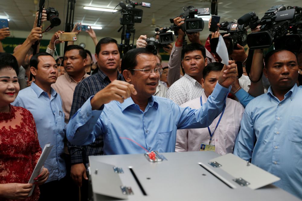 Cambodia's Prime Minister and President of the Cambodian People's Party (CPP) Hun Sen prepares to cast his vote as his wife Bun Rany stands beside him at a polling station in Takhmao, Cambodia July 29, 2018. u00e2u20acu201d Reuters pic