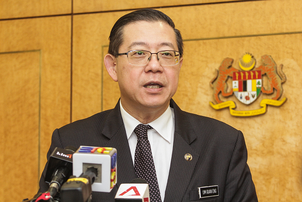 Lim Guan Eng speaks to reporters at Parliament in Kuala Lumpur August 6, 2018. u00e2u20acu201d Picture by Miera Zulyana