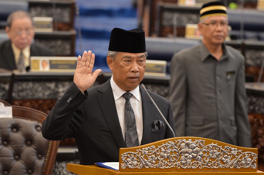 Home Minister Tan Sri Muhyiddin Yassin is sworn in as the Member of Parliament for Pagoh in Kuala Lumpur August 14, 2018. u00e2u20acu201d Picture by Mukhriz Hazim