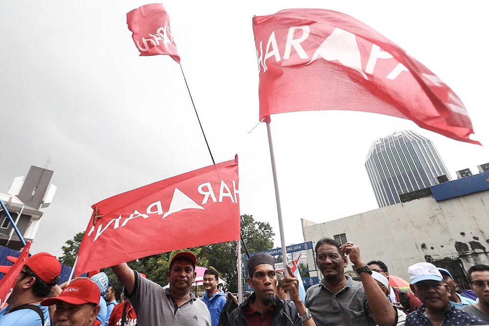 Pakatan Harapan supporters waving the coalition's flag on Nomination Day of the Seri Setia by-election in Petaling Jaya August 18, 2018. u00e2u20acu201dPicture by Hari Anggara