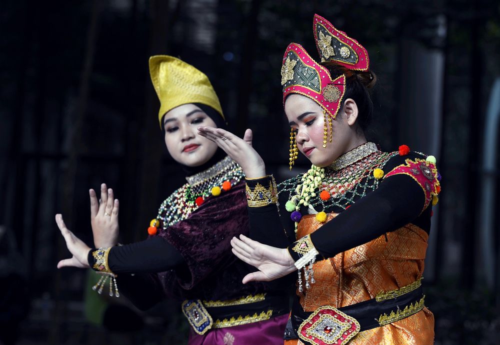 Dancers from the Mak Yong Bunga Emas Sri Temenggong group perform at the book launch. u00e2u20acu201d Picture by Ham Abu Bakar