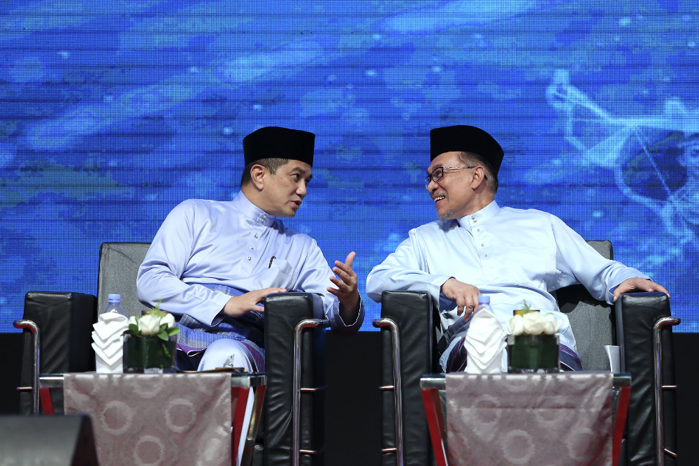 Datuk Seri Azmin Ali and Datuk Seri Anwar Ibrahim chat during the Congress on the Future of Bumiputera and the Nation at the Kuala Lumpur Convention Centre September 1, 2018. u00e2u20acu201d Picture by Yusof Mat Isa