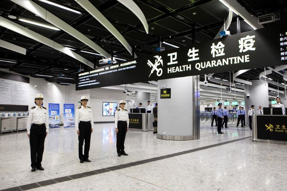 Officers stand under a sign reading u00e2u20acu02dcHealth Quarantineu00e2u20acu2122 at the West Kowloon Station in Hong Kong on September 22, 2018. The new rail link between Hong Kong and southern China will see joint immigration checkpoints in the heart of the city. u00e2u20acu201d AFP pic