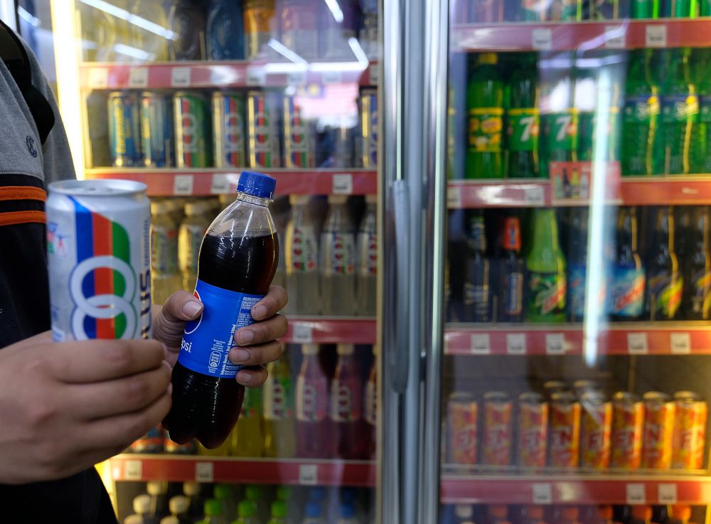 Malaysia is considering a tax on soft drinks, but it may not be enough to push Malaysians to reduce their sugar consumption. u00e2u20acu2022 Bernama pic