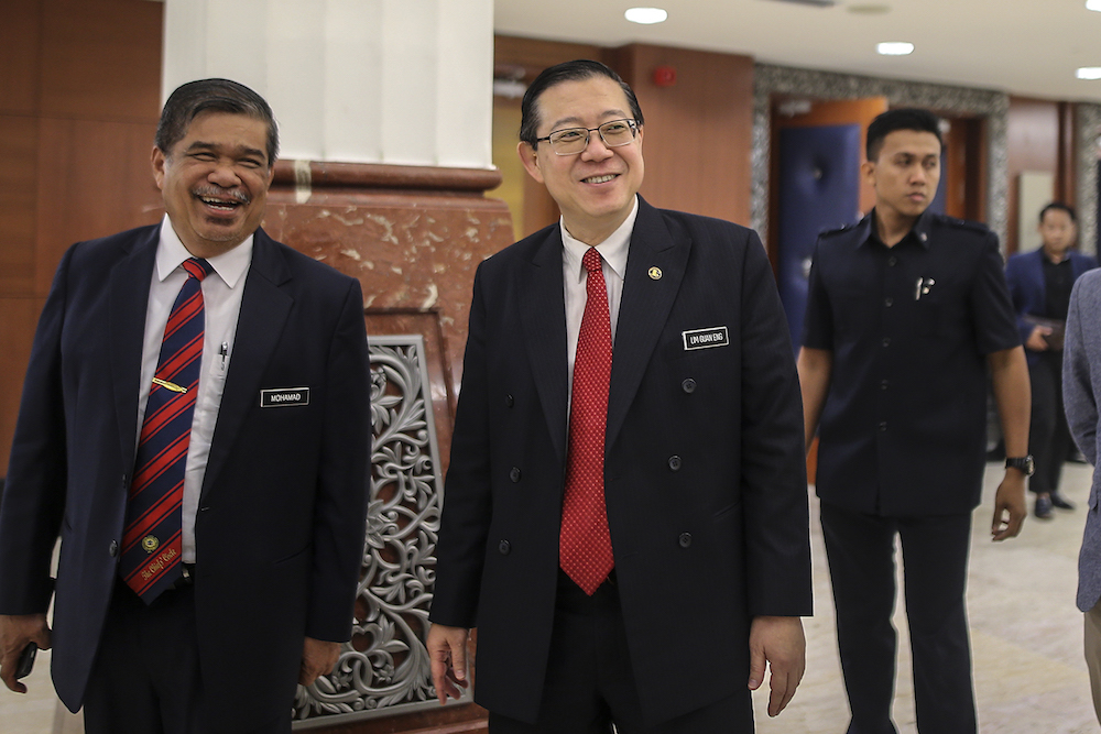 Mohamad Sabu and Lim Guan Eng attend Parliament in Kuala Lumpur October 15, 2018. u00e2u20acu201d Picture by Azneal Ishak