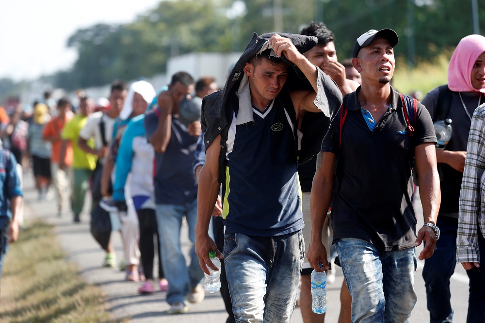 Central American migrants walk along the highway near of Ciudad Hidalgo after crossing to Mexico from Guatemala willing to reach the US, October 29, 2018. u00e2u20acu201d Reuters pic