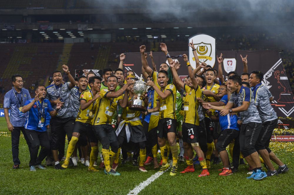 Perak players celebrate winning the Malaysia Cup in the Shah Alam Stadium on October 27, 2018. u00e2u20acu201d Picture by Miera Zulyana