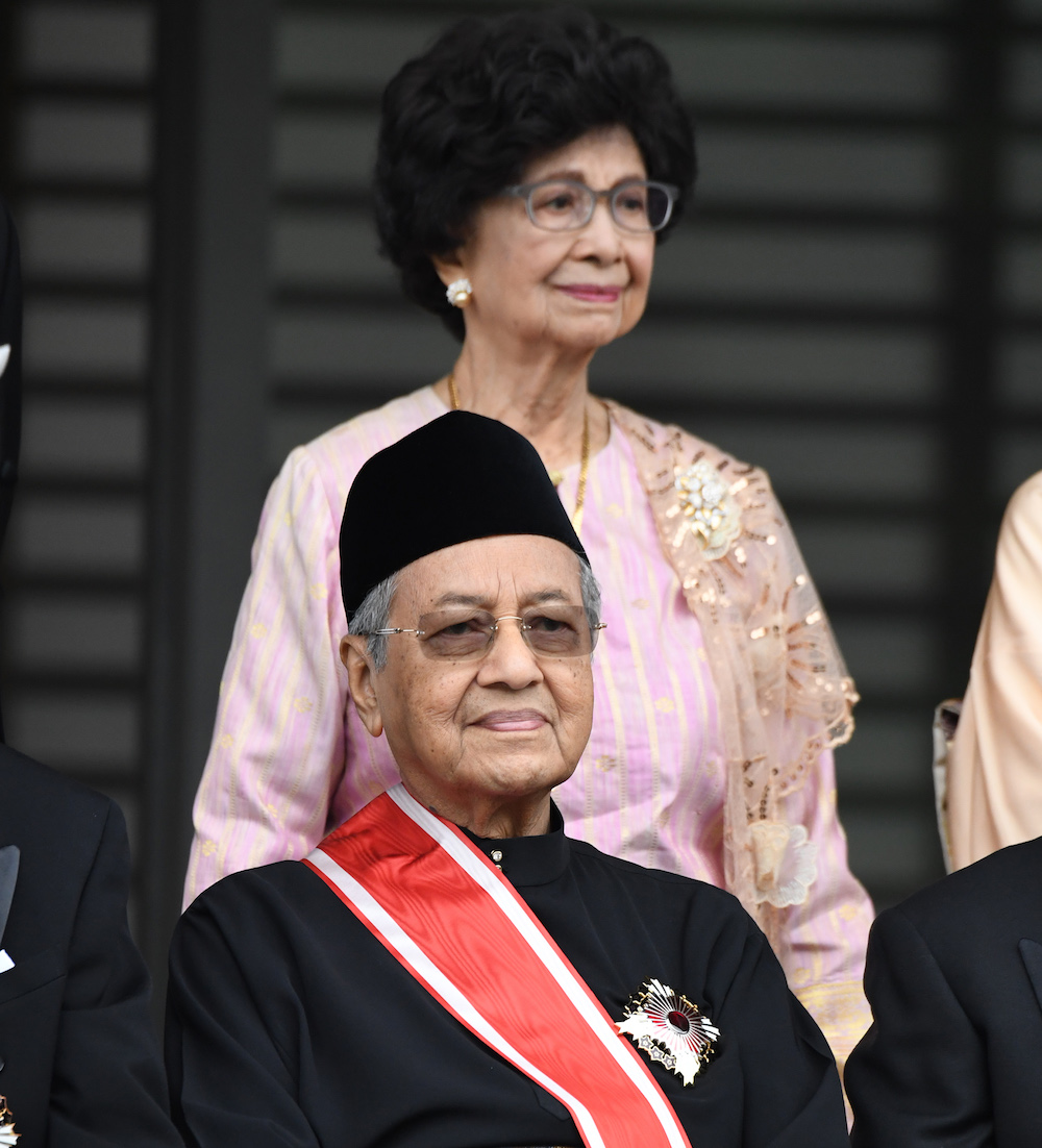 Tun Dr Mahathir Mohamad poses for a photo session with his wife Tun Dr Siti Hasmah Mohamad Ali after receiving the Grand Cordon of the Order of Paulownia Flowers at the Imperial Palace in Tokyo November 6, 2018. u00e2u20acu201d AFP pic