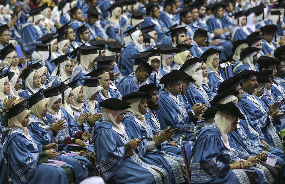 Graduates attend the International Islamic University Malaysiau00e2u20acu2122s 34th convocation ceremony in Gombak November 10, 2018. u00e2u20acu201d Picture by Azneal Ishak