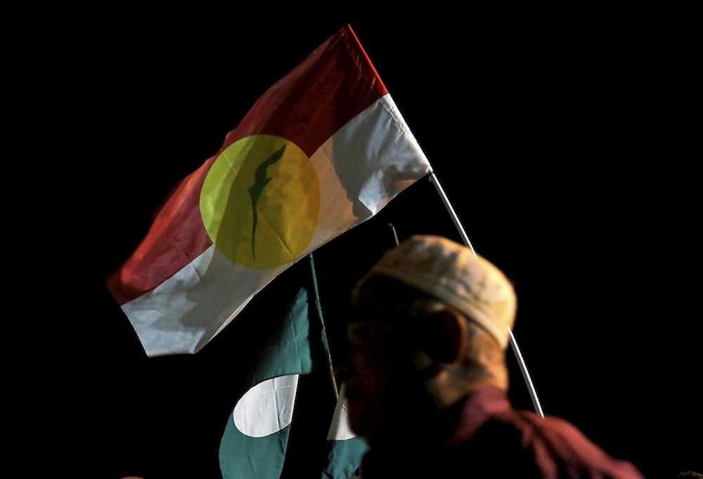 PAS and Umno flags are seen during an ICERD protest in Kampung Gajah, Perak November 17, 2018. u00e2u20acu201d Picture by Farhan Najib